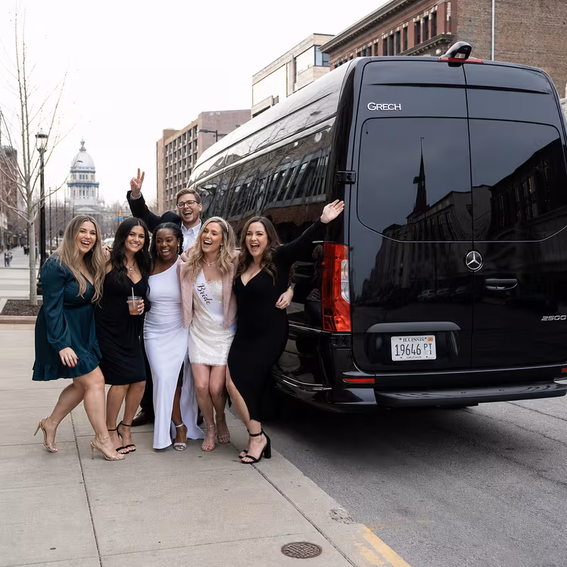 Group boarding a white charter bus for Bachelor & Bachelorette Transportation transportation in Springfield