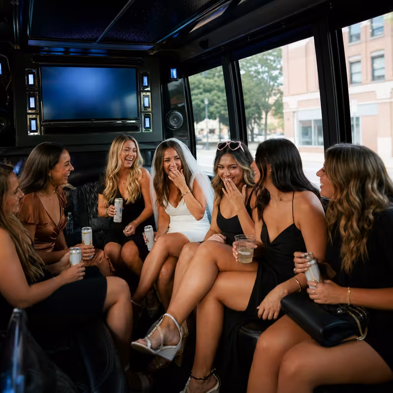 Party bus interior with wraparound leather seating and LED lighting in Springfield