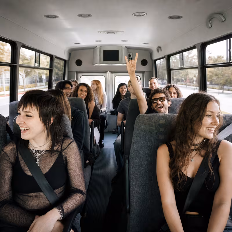 Party bus interior with wraparound leather seating and LED lighting in Springfield