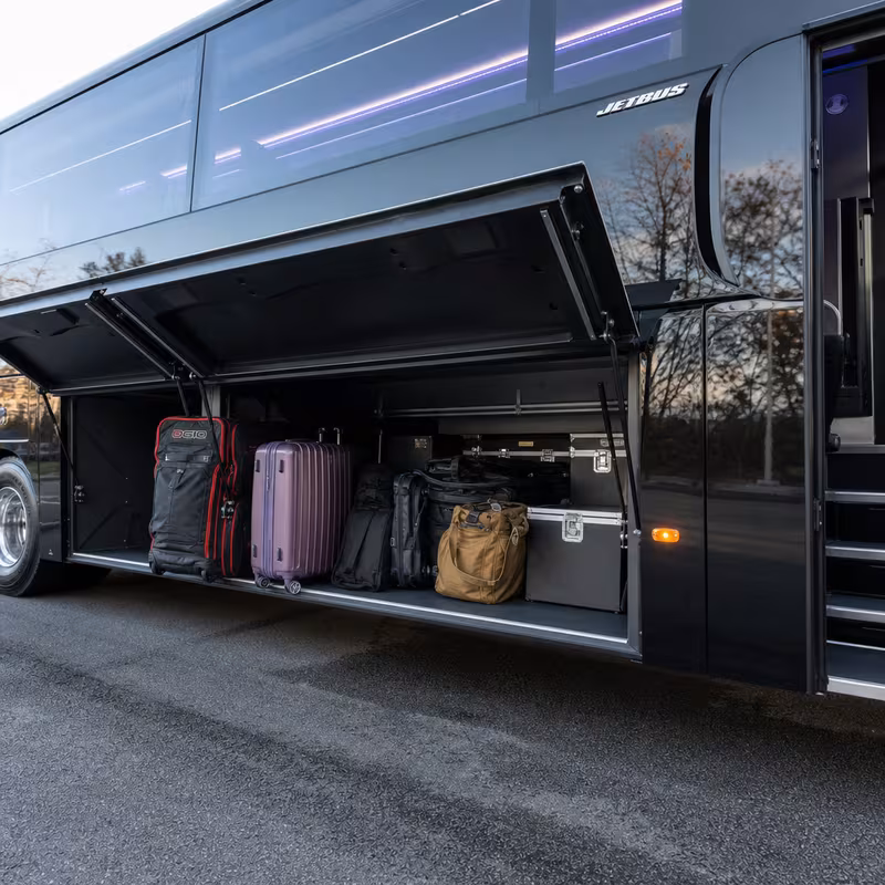 Party bus interior with wraparound leather seating and LED lighting in Springfield