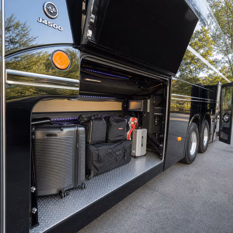 Party bus interior with wraparound leather seating and LED lighting in Springfield