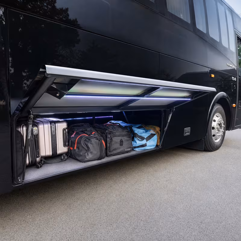 Party bus interior with wraparound leather seating and LED lighting in Springfield